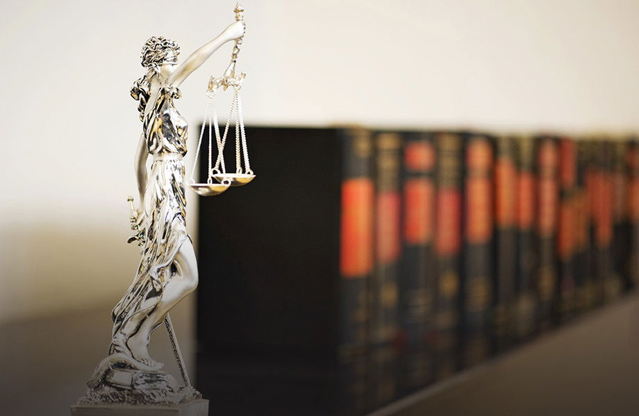 Scales of justice with law books; civil litigation